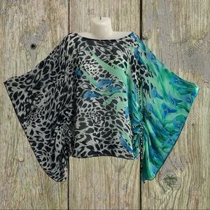 Gorgeous flowy coverup with ruched sides.